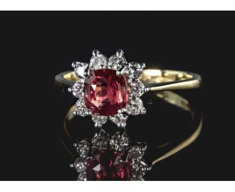 An 18ct white gold, Padparadscha sapphire and diamond cluster ring, the 1.53ct cushion cut sapphire of fine orange-pink colou