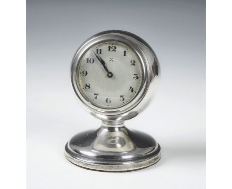 A George V silver desk clock, the silvered Arabic dial within a circular case on flared pedestal base, Chester 1928, 3¾in. (9