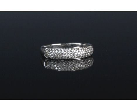 An 18ct white gold and diamond bombe ring, pavé set with brilliant cut diamonds, ring size M.