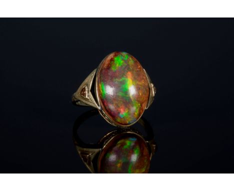 A 1930s Art Deco gold and cabochon boulder opal ring, possibly an Ethiopian Welo opal, probably 9ct, maker's mark BJT, the hi