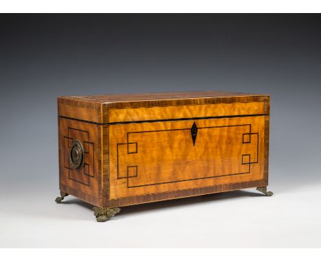 A George III satinwood tea caddy, of rectangular form, with circular brass handles to sides, inlaid banding, and geometric eb