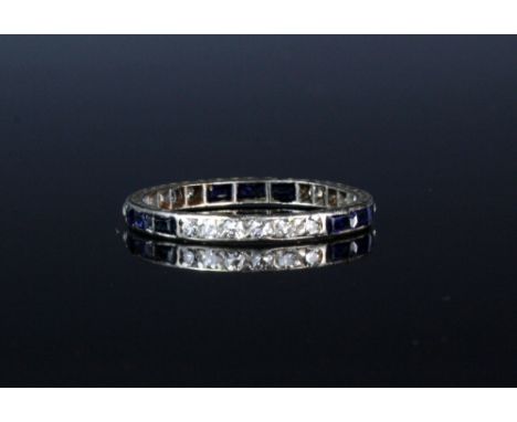 An Art Deco sapphire and diamond eternity ring, 1930s, the white metal (probably platinum) band set with alternating rows of 