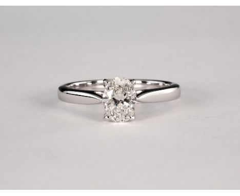 An 18ct white gold and diamond single stone ring, the unusual, oval cut 1.01ct diamond, GIA Cert. G/VS2, in a four claw setti