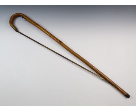 A Victorian saw stick novelty walking cane, with crook handle and spring loaded brass mount for locking blade, 38¾in. (97.25c