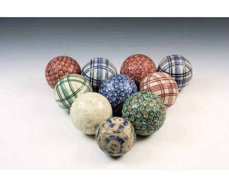 A collection of ten Scottish pottery carpet bowls, of spherical form, including four sponge printed with allover floral decor