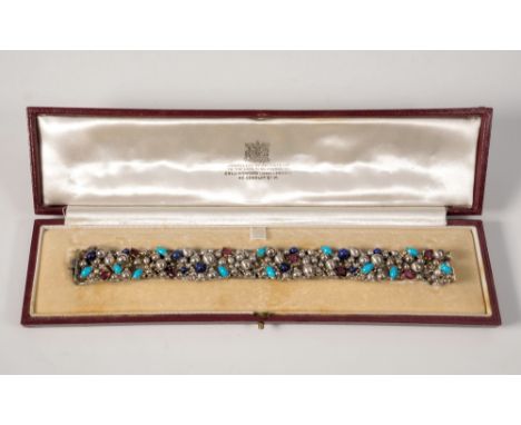 A Stuart Devlin for Collingwood 18ct white gold, ruby, turquoise, seed pearl and lapis lazuli bracelet, hallmarked London, 19
