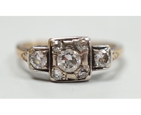 An early 20th century yellow metal and diamond cluster set ring, size K, gross weight 2 grams.