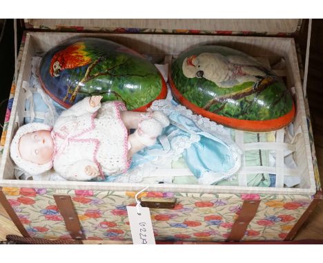 A doll's trunk containing three dolls including an Armand Marseille 341 and clothing