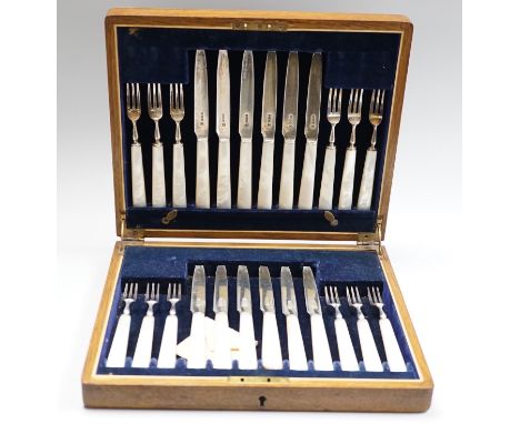 A cased set of twelve pairs of George V mother of pearl handled silver dessert eaters, Isaac Ellis &amp; Sons, Sheffield, 192