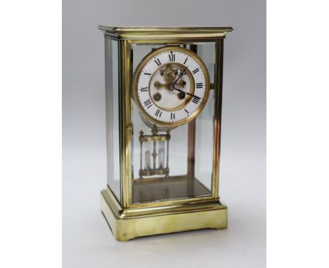 A late 19th century brass and four glass mantel clock, 30cm high