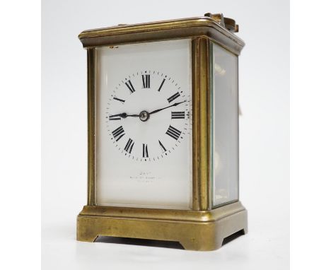 A striking carriage clock, 12cm tall