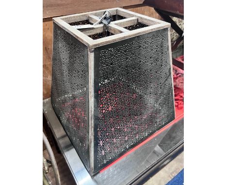 A pierced metal and hardwood hanging lamp shade, height 47cm *Please note the sale commences at 9am.
