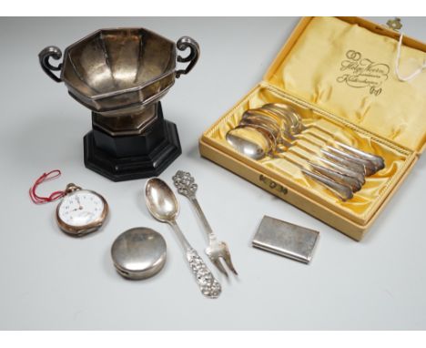 A late Victorian silver vesta case, a silver pill box, a small silver trophy cup,  a cased set of six Swedish white metal cof