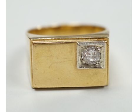 A 750 yellow metal and single stone diamond set signet ring, size Q/R, gross weight 10 grams.