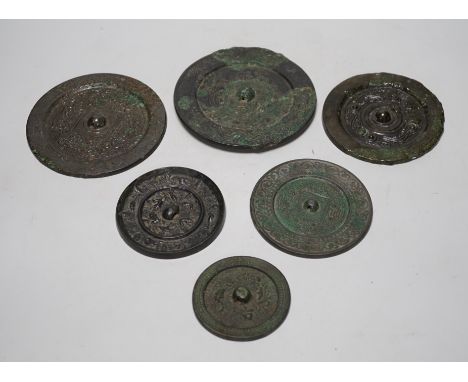 A group of six Chinese archaic bronze mirrors, including two Han dynasty TLV mirrors, and a Tang dynasty squirrel and vine sm