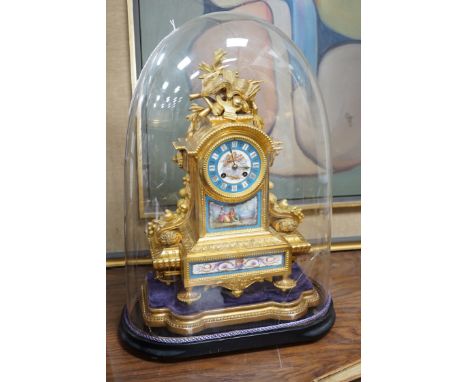 A late 19th century French ormolu and Serves style porcelain mounted mantel clock