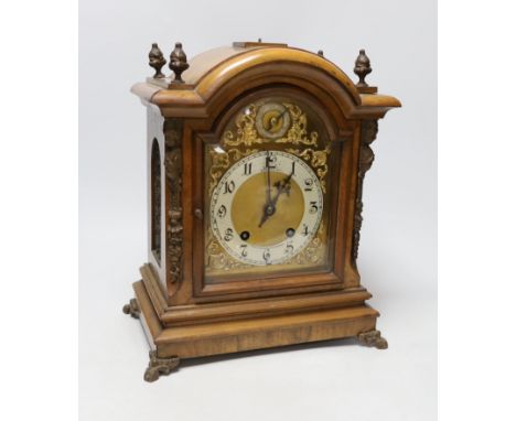 A walnut ting tang mantel clock, 34cms high