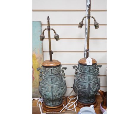 A pair of Chinese archaistic bronze ‘hu’ telescopic table lamps
