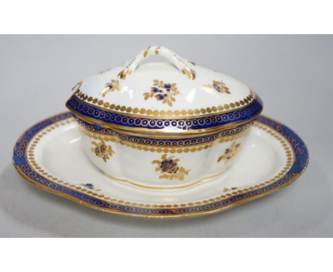 An 18th century Caughley tureen cover and stand with blue and gilt decoration, stand mis-fired to border, S mark to stand and