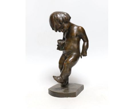 A bronze cherubic boy, signed J. Kostiak, 26cm high