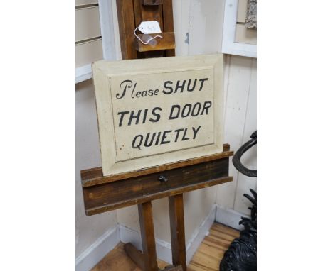 A beech artist's easel, height 170cm, with a door shutting sign *Please note the sale commences at 9am.