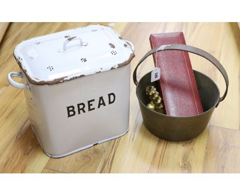 A brass cooking pot, a gilt metal candlestick, an enamel bread bin and cased fish servers