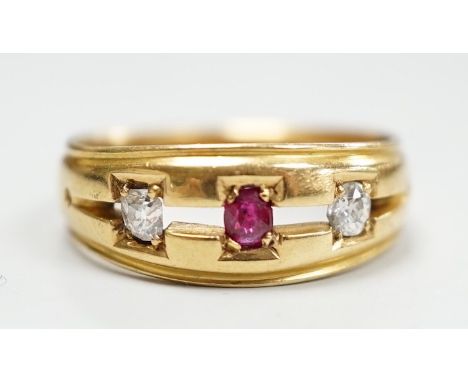 A late Victorian 18ct gold, ruby and diamond set three stone ring, size K/L, gross weight 4 grams.