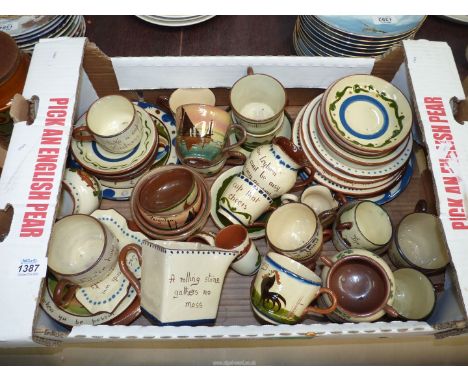 A box of Torquay ware including cups, saucers, plates, egg cups, etc.