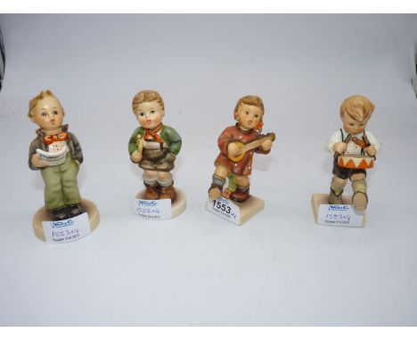 Four Goebel figures to include; a drummer boy, a choir boy, a girl with a banjo and a boy with a trumpet. All approx 4" tall.