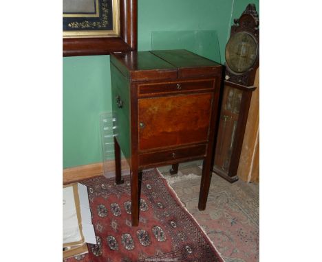 A 19th c. Mahogany campaign Washstand, the clam-shell action top revealing an interior with a bowl aperture and four sub-aper