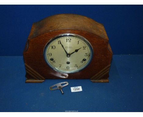 A Westminster chiming Mantle clock by Kemp Bros. Union St., Bristol, with replacement key and pendulum, 12'' wide x 8 1/2'' t