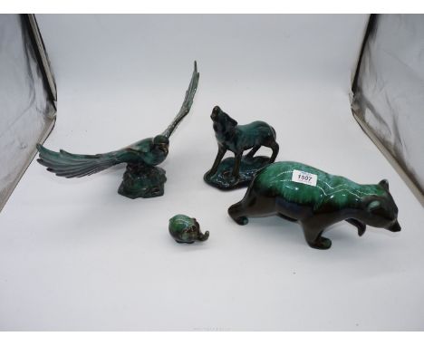 Four models of Eagle, Bear, Wolf, Elephant in dark to light green, one marked BMP to the base.