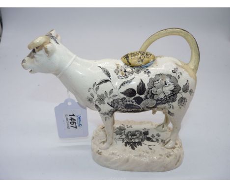 A circa 1830 Dilwyn Swansea black transfer printed cow creamer with shells and flower decoration, some restoration, crack to 