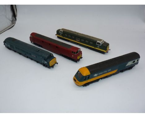 Four nicely detailed display models of locomotives at approximately "00" scale and including Intercity green livery diesel lo