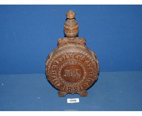 A 19th century Austrian heavily carved decorative moon shape circular wooden Flask with coat of arms and initials, date 1881,