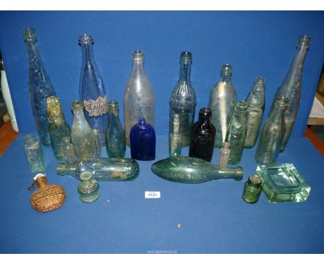 A quantity of glass bottles including Codd bottles, wicker bound flask, Bristol blue bottle, etc. some a/f.