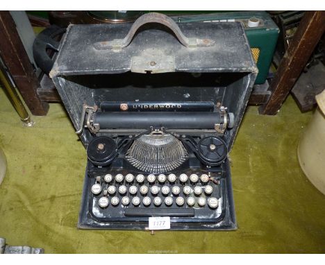 A vintage Underwood typewriter with case.