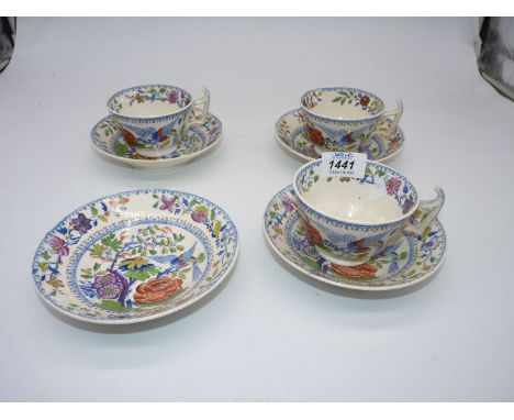 Three porcelain teacups and four saucers having Flying bird design.