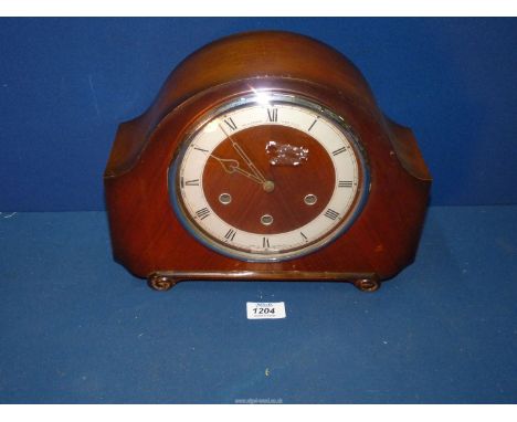 An Alexandra Clark Co Ltd Mantle Clock with key and pendulum, 9 1/2" tall x 12" wide.
