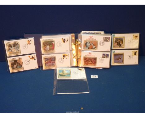 A file of First Day Cover postcards including Great British Athletes, Football Heroes, Children's TV etc.