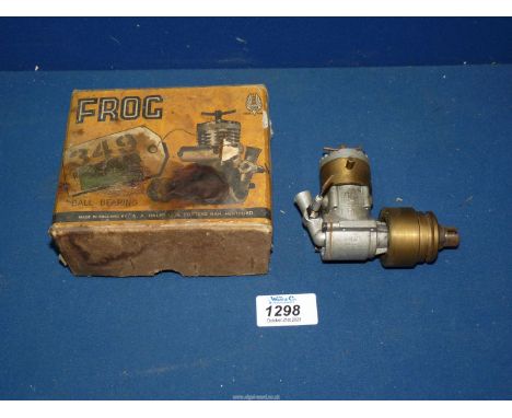 A Boxed "Frog 349" 3.47cc/.21 cubic inch single cylinder water coded Diesel engine for a model boat having a brass flywheel. 