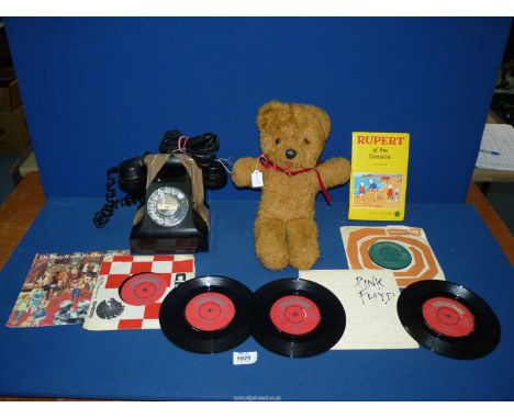 A quantity of miscellanea to include a collection of seven vinyl singles, 1973 'Rupert at the Seaside' book, vintage 1960's T