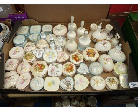 A quantity of Palissey Royal Worcester bells, small trinket dishes with lids and four egg shaped dishes.