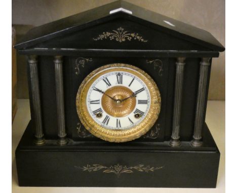 A Victorian black slate mantle clock by the Ansonia Clock Co, USA