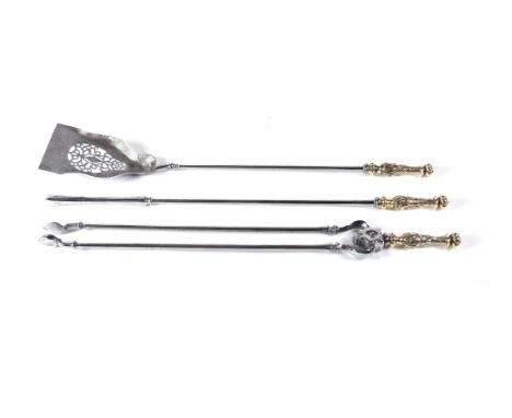 A set of three early Victorian steel and brass mounted fire tools, circa 1840, comprising shovel, poker and tongs, the gadroo