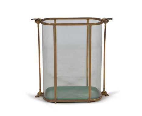 A gilt metal and glass panelled stick stand, late 19th/ early 20th century, the shaped frame case with fine reeded detail thr