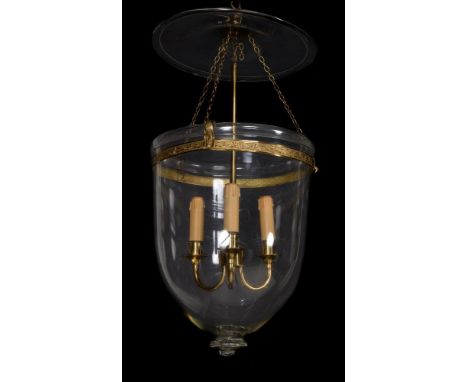A glass and gilt metal mounted hall lantern, circa 1815 and later, the domed canopy suspending a bell shade, with bands of sc