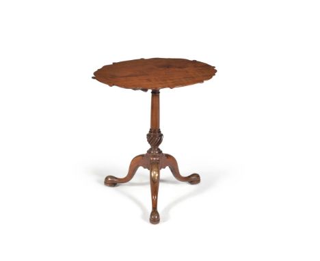 A George III mahogany and brass mounted tripod table, circa 1770, in the manner of Frederick Hintz, the fiddle back mahogany 