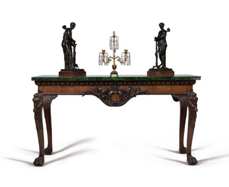 A carved mahogany and malachite mounted console table, in George II style, late 19th/ early 20th century, the malachite venee