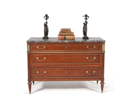 A Directoire mahogany, plum pudding mahogany and gilt metal mounted commode, circa 1795, the variegated marble top with round